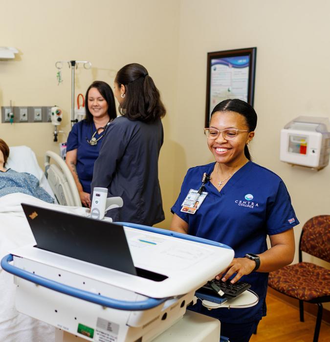 College students working in Centra College simulation center